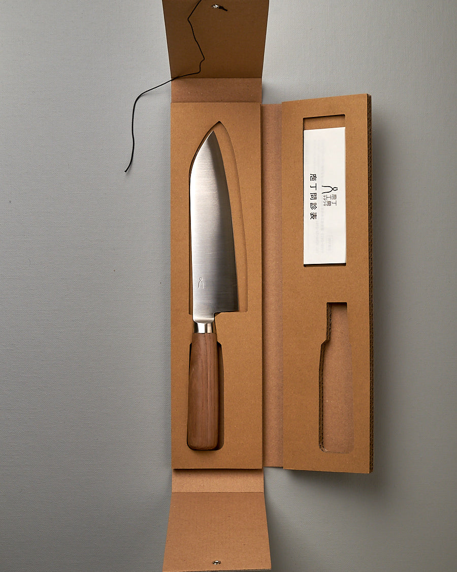 A Hocho Santoku knife in a cardboard box made by Tadafusa.