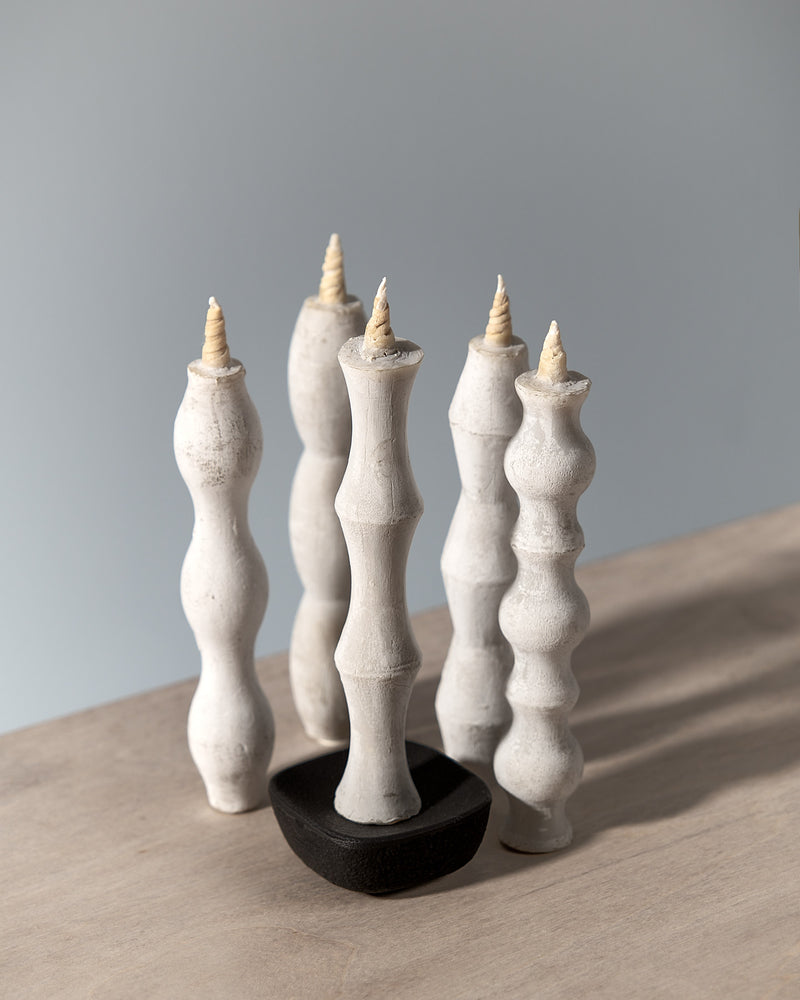 A group of Takazawa NANAO – 5 Piece Mixed Box Set candle holders on a table.