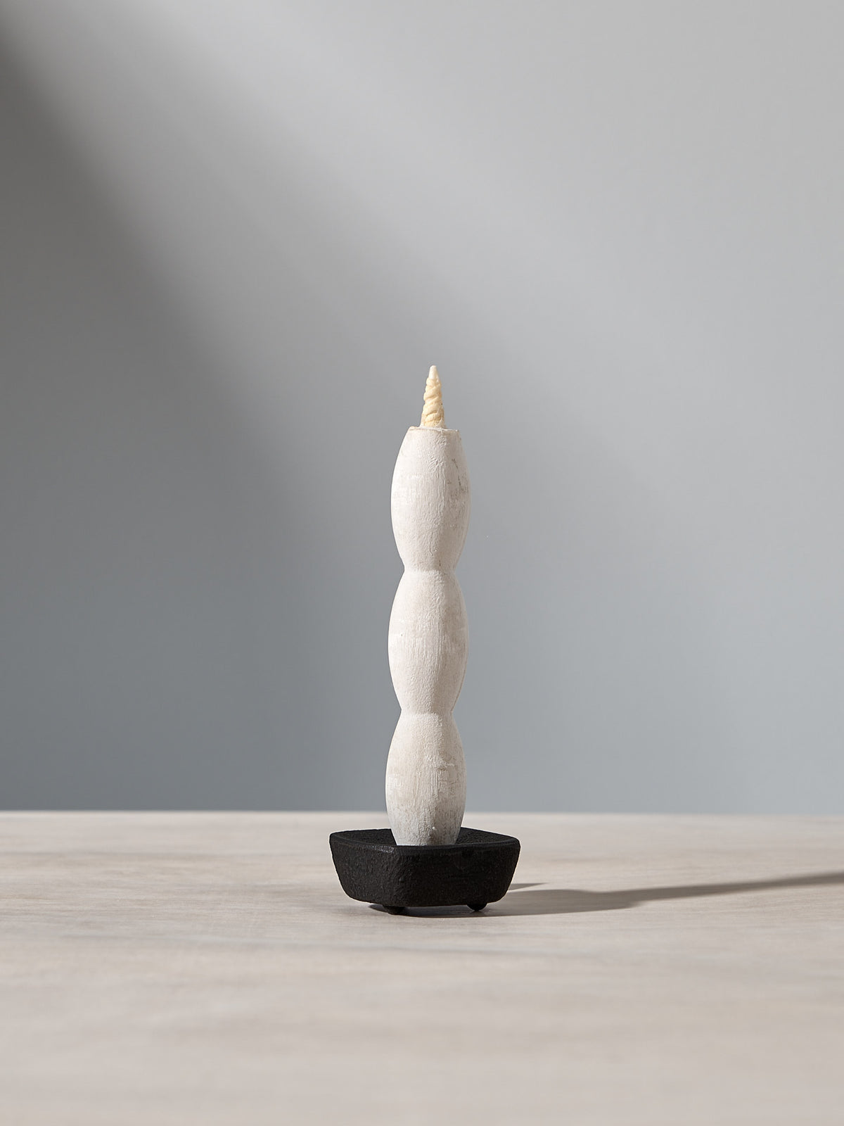 A NANAO – 5 Piece Mixed Box Set candle sitting on top of a wooden table, manufactured by Takazawa.