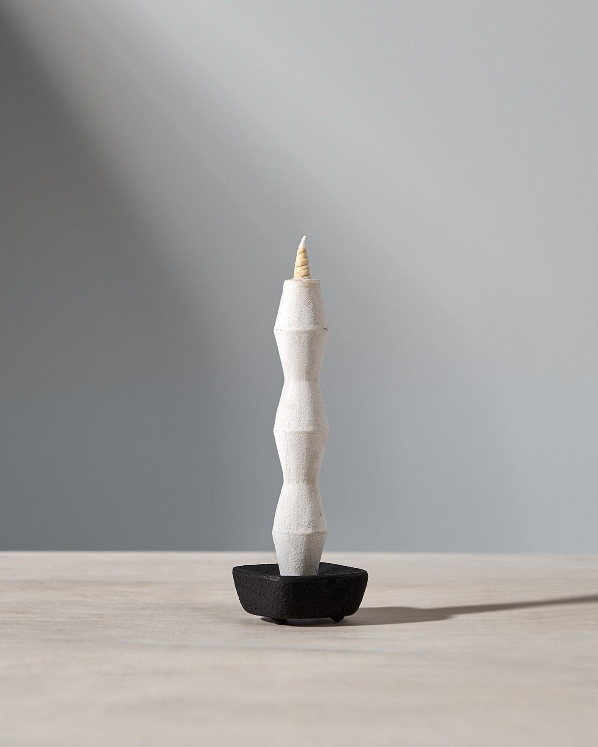 A NANAO – 5 Piece Mixed Box Set candle sitting on top of a wooden table from brand Takazawa.