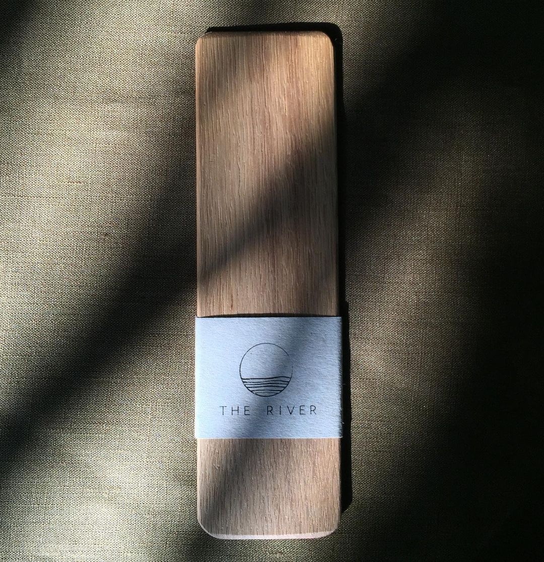 A The River oak cutting board with a Bookmark label on it.