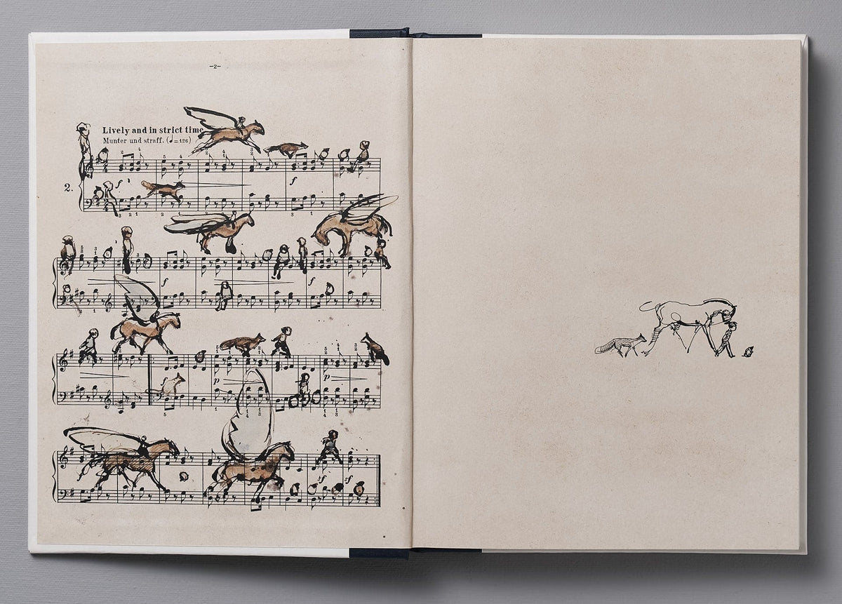 An open book with a drawing of &quot;The Boy, the Mole, the Fox and the Horse&quot; by Charlie Mackesy.