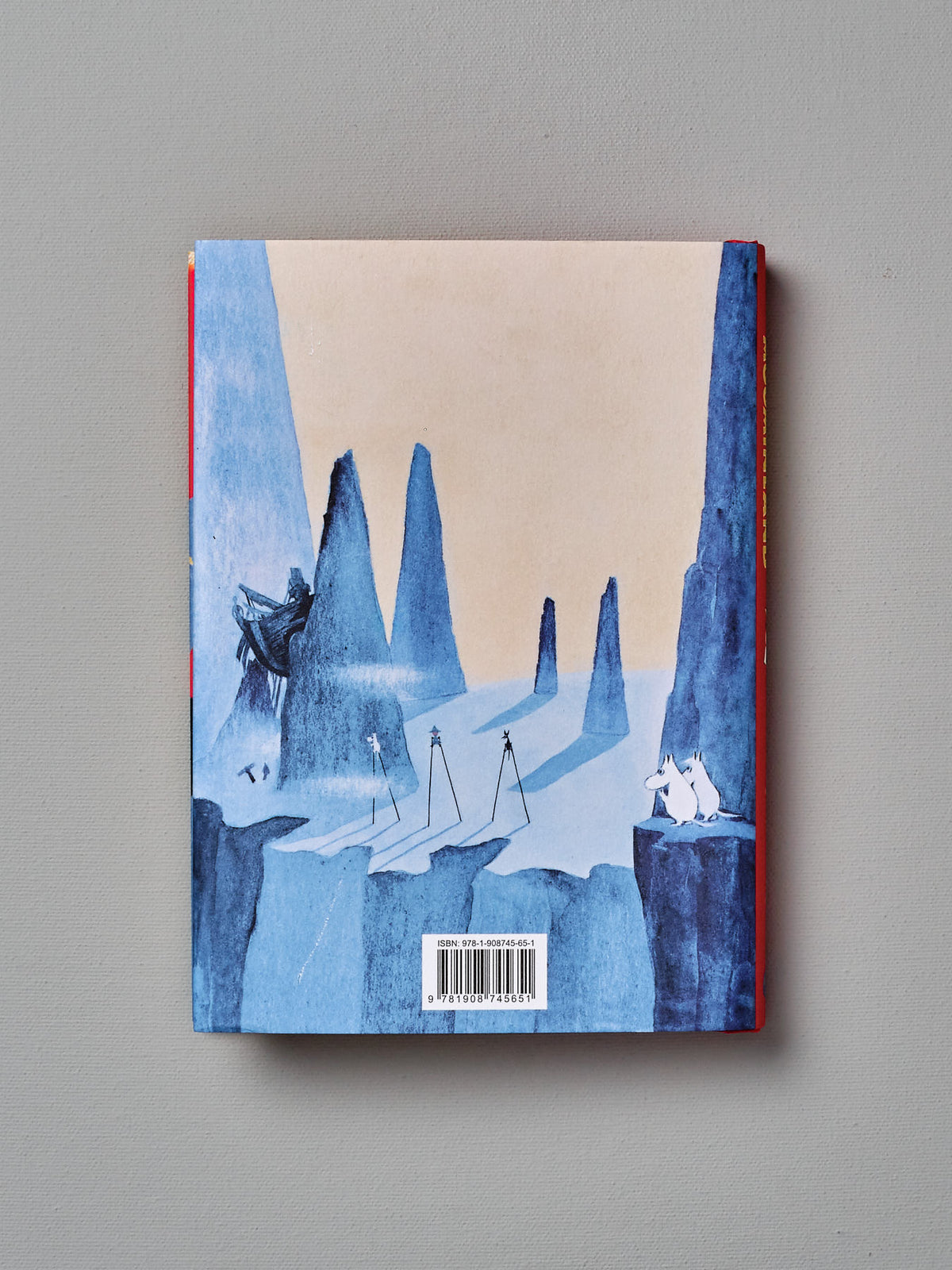 The cover of a children&#39;s book, &quot;Comet in Moominland&quot; by Tove Jansson, with a blue cover.