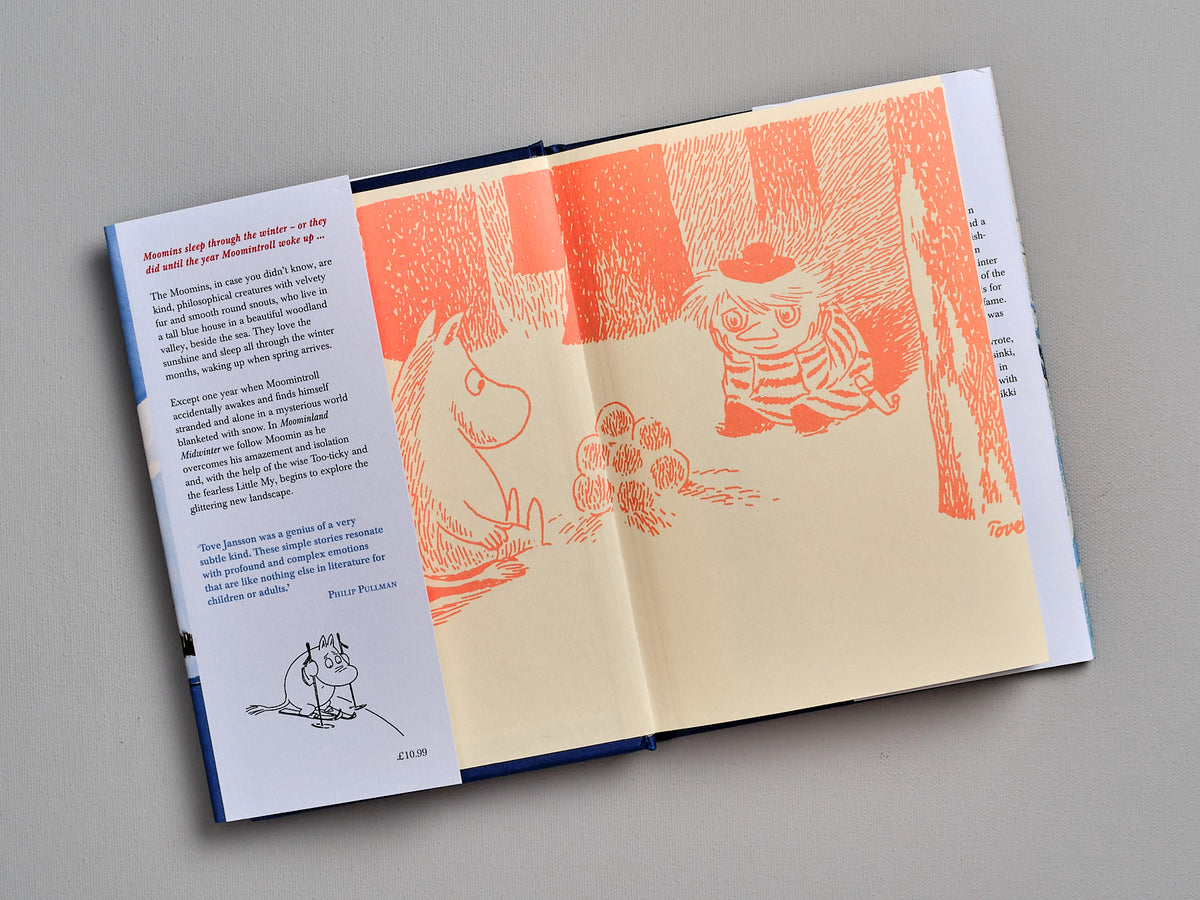 A &quot;Moominland Midwinter&quot; book with a picture of a cat and a dog by Tove Jansson.