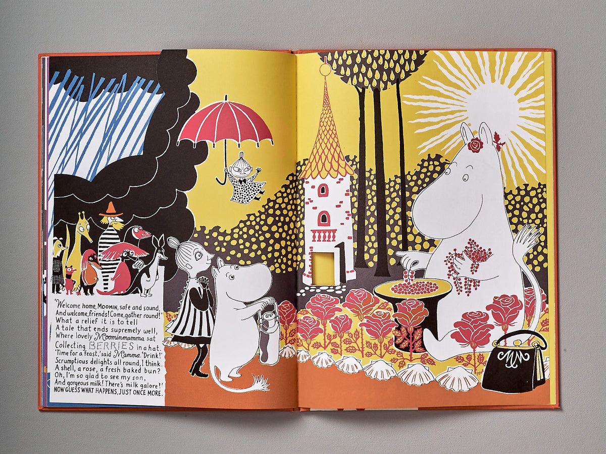 A book with a picture of The Book About Moomin, Mymble and Little My by Tove Jansson and an umbrella.