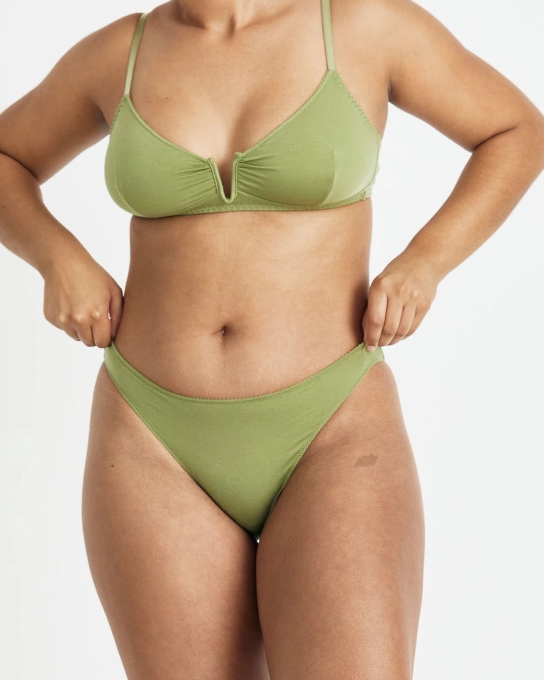 A woman in the Videris Angela Bra – Olive bikini top and bottom.