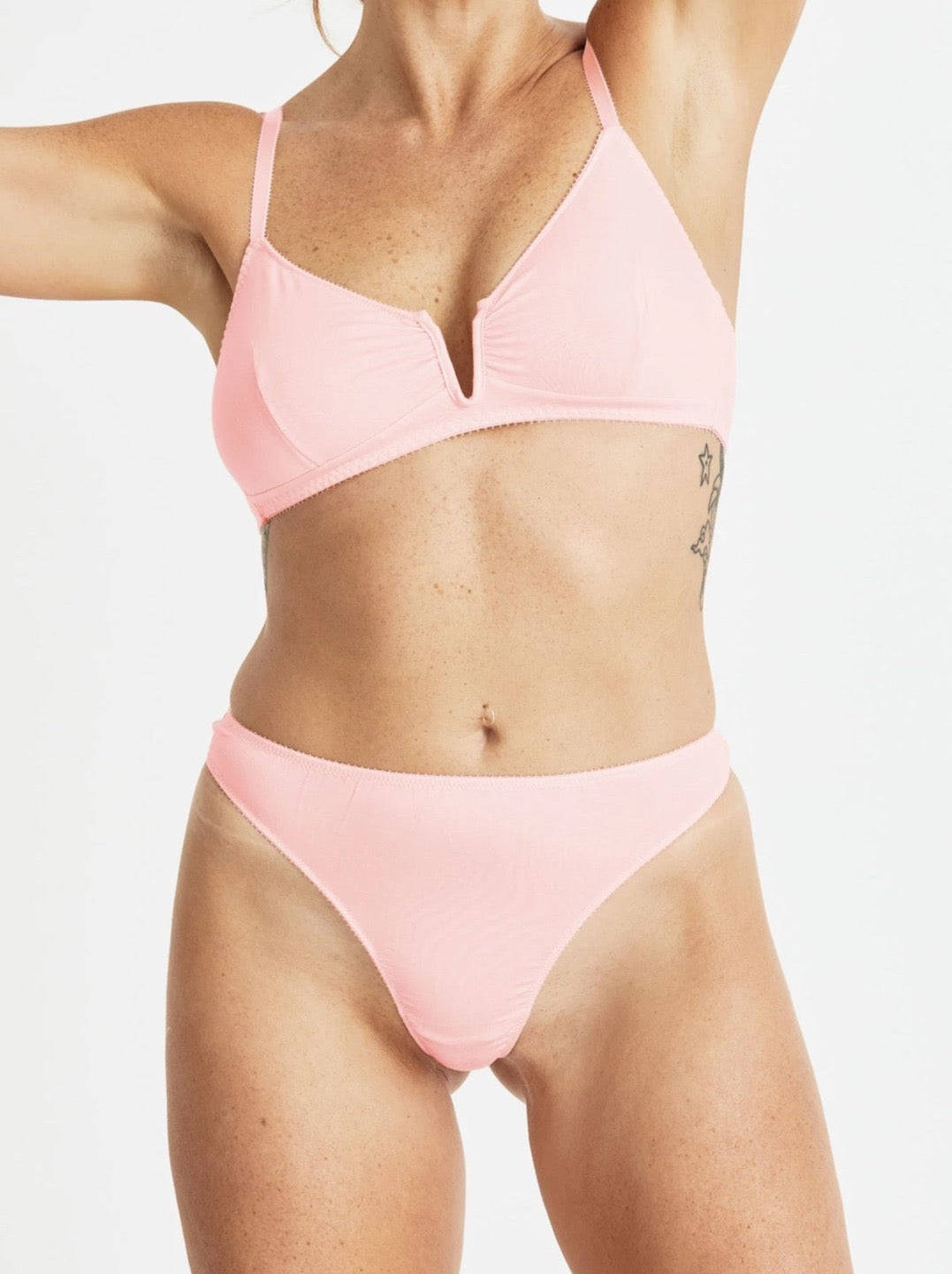 A woman in the Videris Angela Bra - Rosy bikini top and panties.