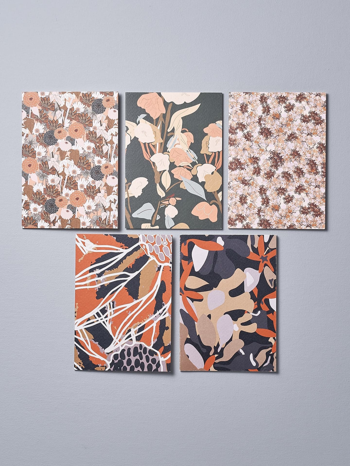 A set of four Greeting Cards – Vintage Floral with orange and black floral designs by Walker & Bing.