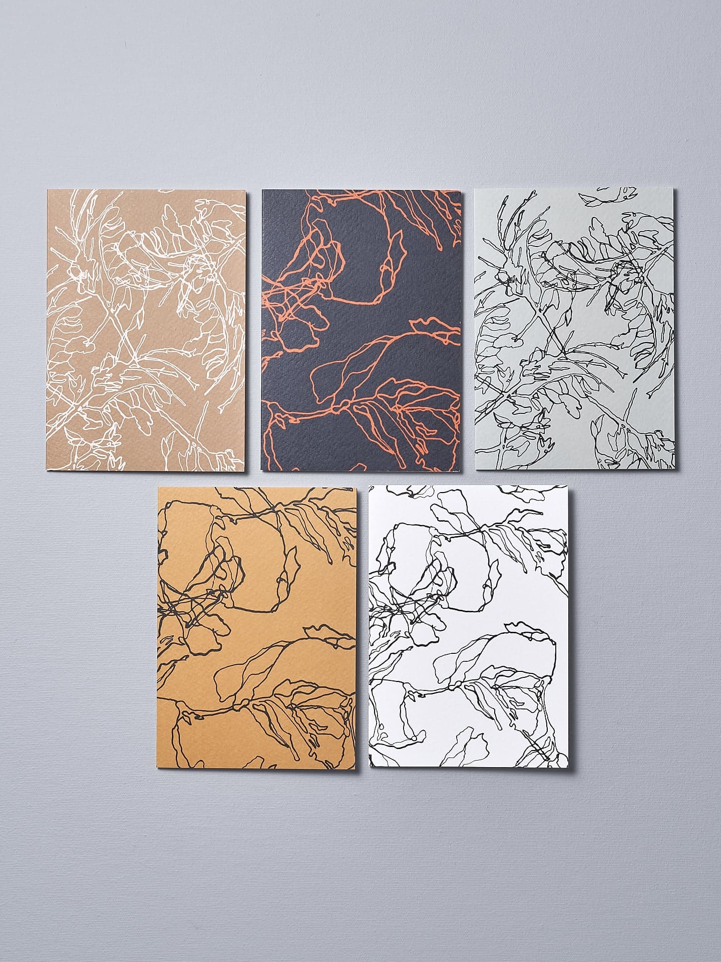 A set of four Walker & Bing Greeting Cards – Floral Outline with different designs on them.