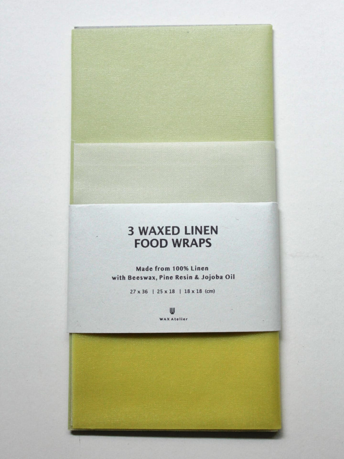 A sustainable alternative to plastic clingfilm, this set includes three Ivy ⋄ Madder ⋄ Indigo waxed linen food wraps made with beeswax, pine resin, and jojoba oil by Wax Atelier.