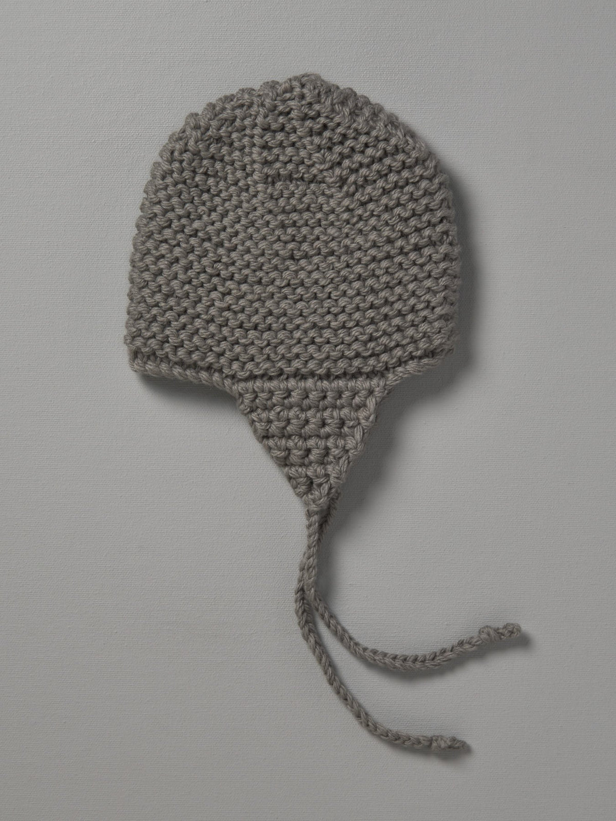 A Hand Knitted Chunky Knit Hat - Mushroom by Weebits on a white background.