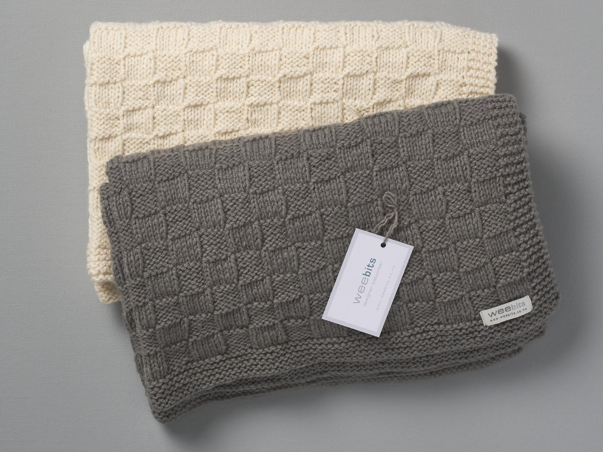 Two Hand Knitted Travel Rugs - Natural with tags on them, made from merino wool. These cozy Weebits blankets are perfect for keeping babies warm and can also double as travel rugs.