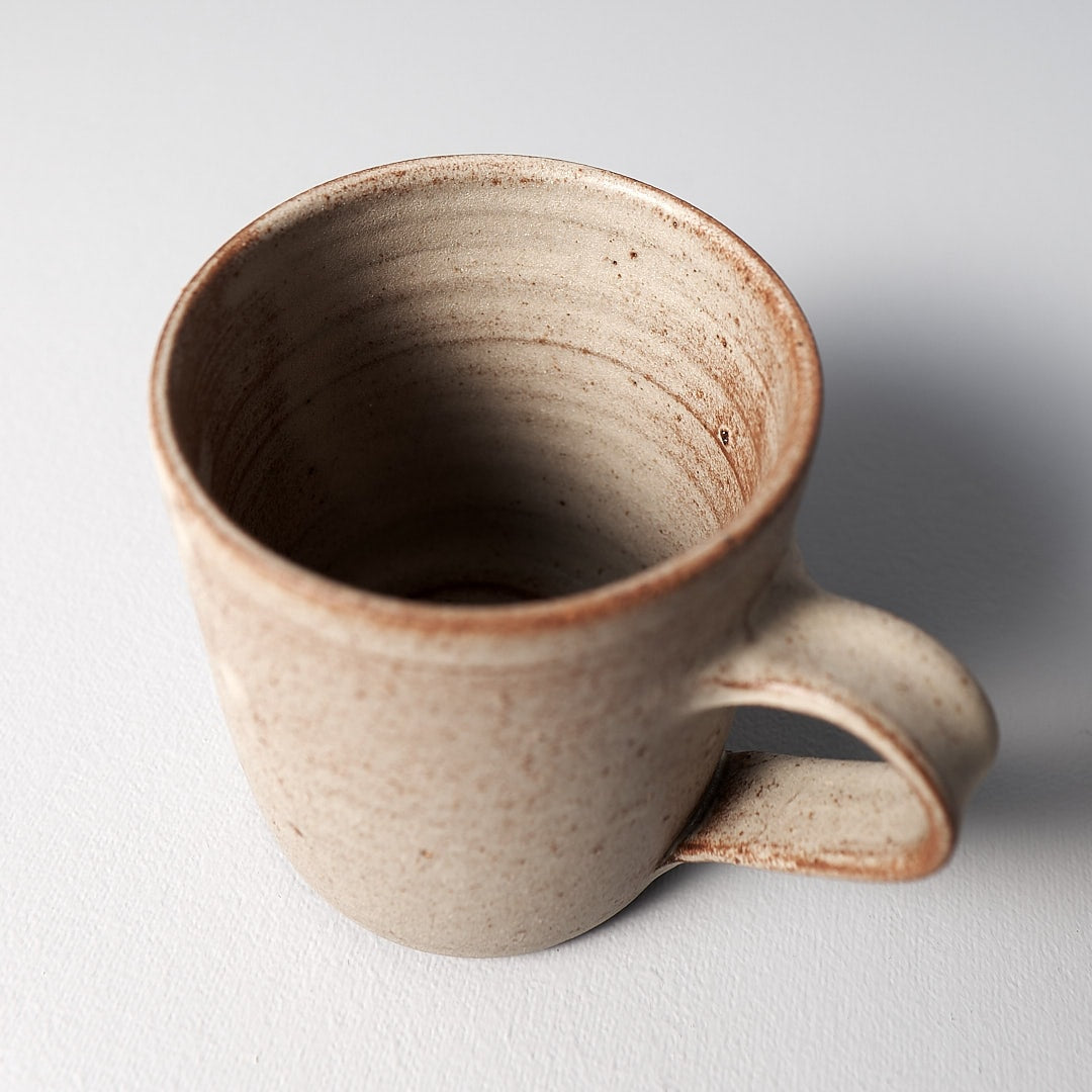 An image of a Zoë Isaacs coffee mug – Cream on a white surface.