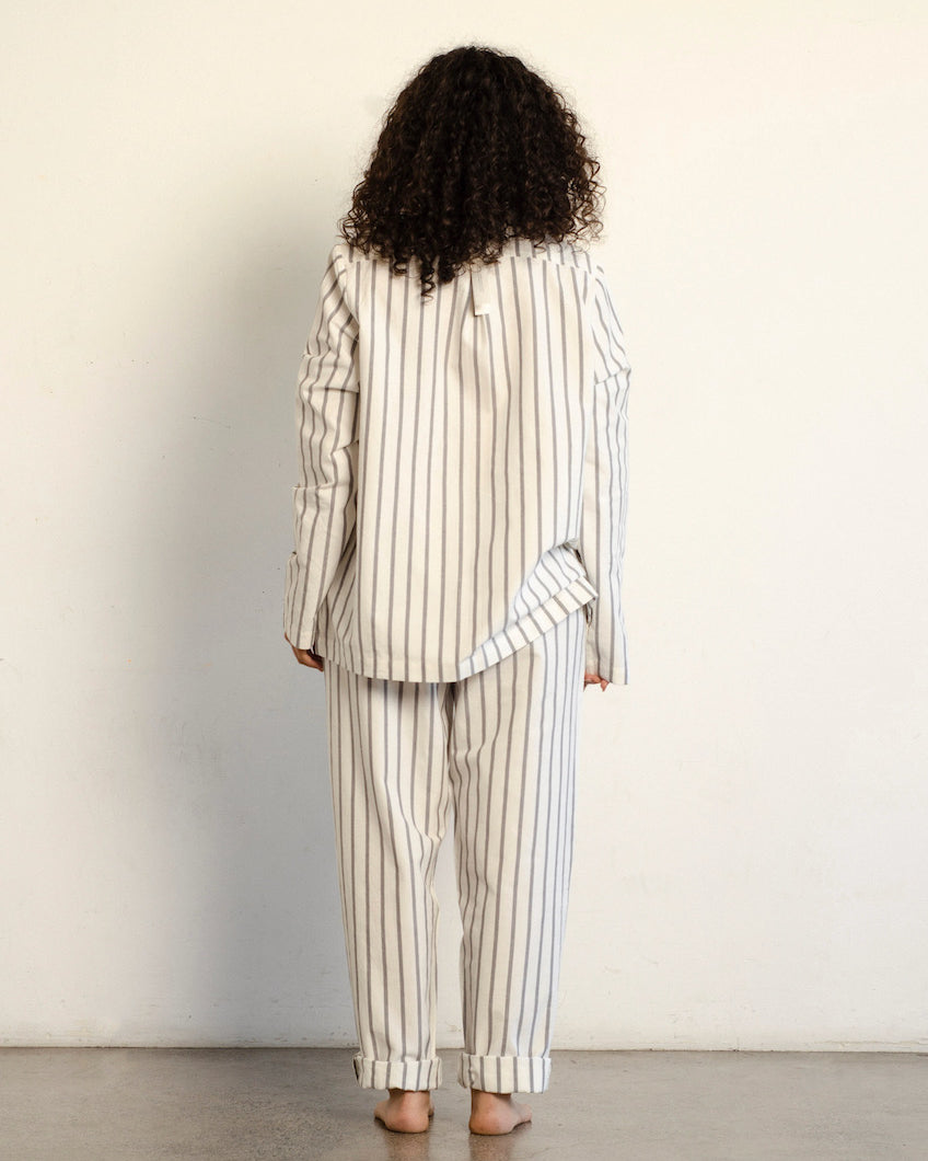 The back of a woman wearing a general sleep Classic Set - Stripe pajama set.