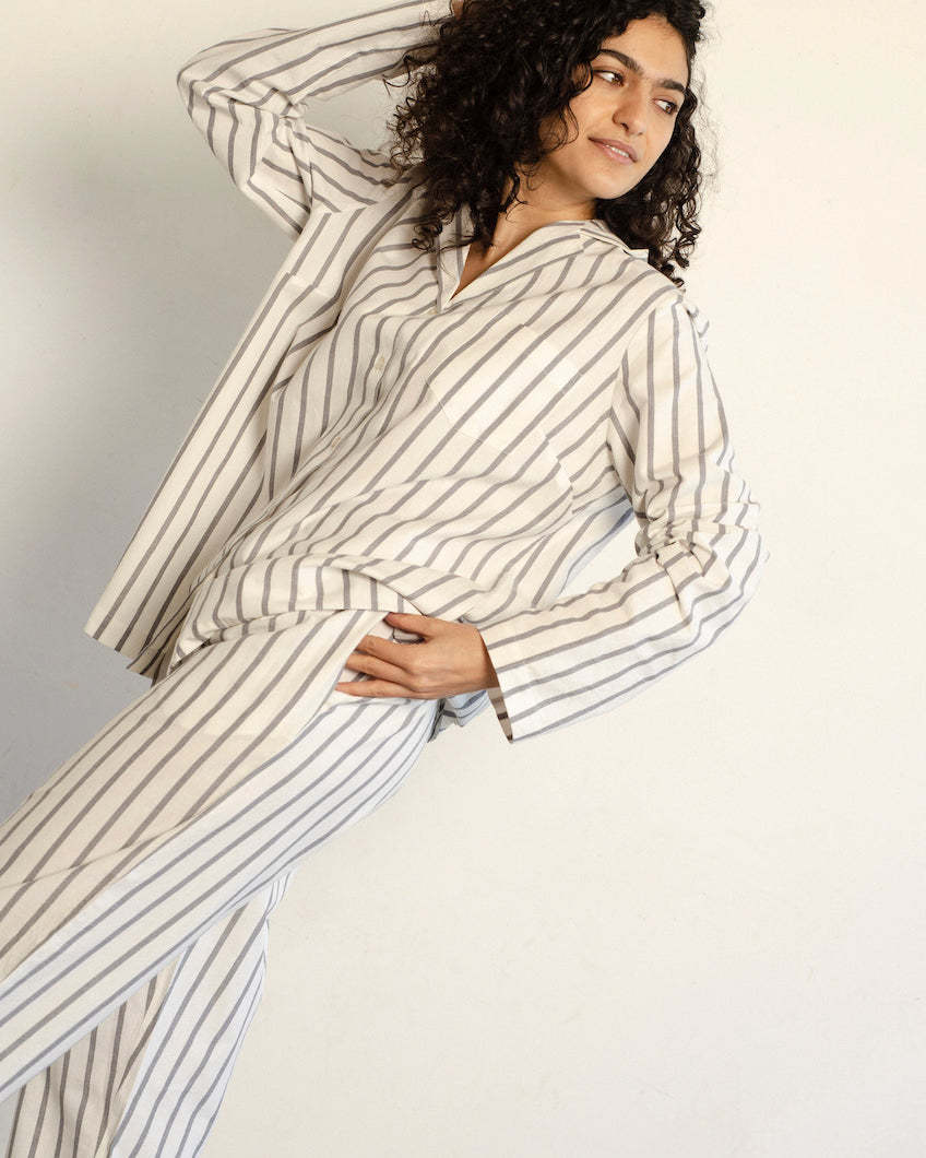 A woman wearing a white and grey striped Classic Set - Stripe by general sleep.