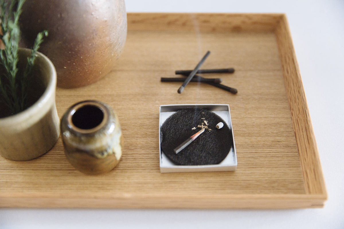 hibi Match Box Incense Deep – Cedar Wood sticks on a wooden tray.