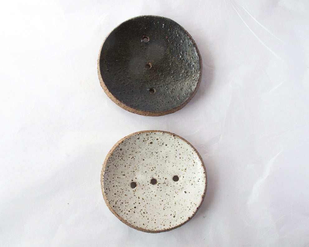 Two Round Ceramic Soap Dishes - White with Black Speckle by Studio Star on a white surface.