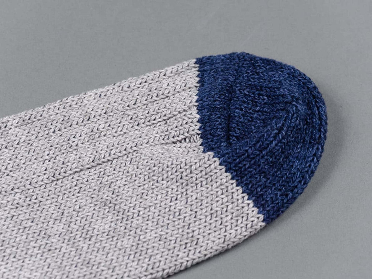 A close up of a Boston Slab Socks – Grey Denim by Nishiguchi Kutsushita.