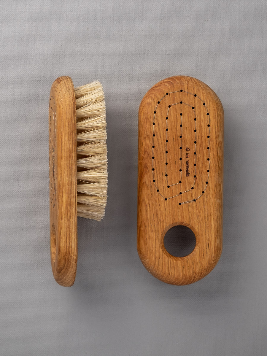 Two Iris Hantverk Body Brushes – Firm on a grey background.