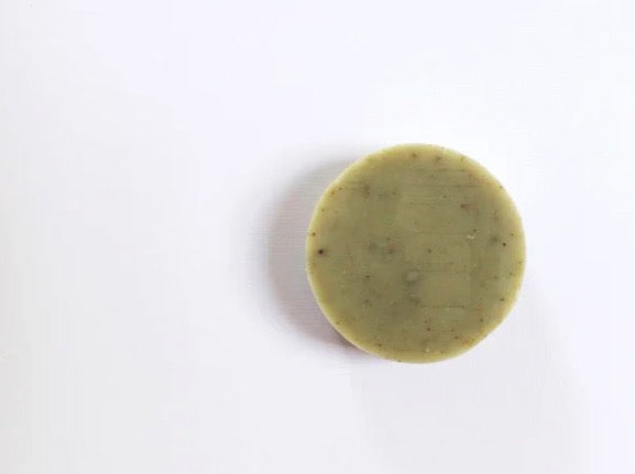 A green Wakame Soap bar on a white surface by Studio Star.